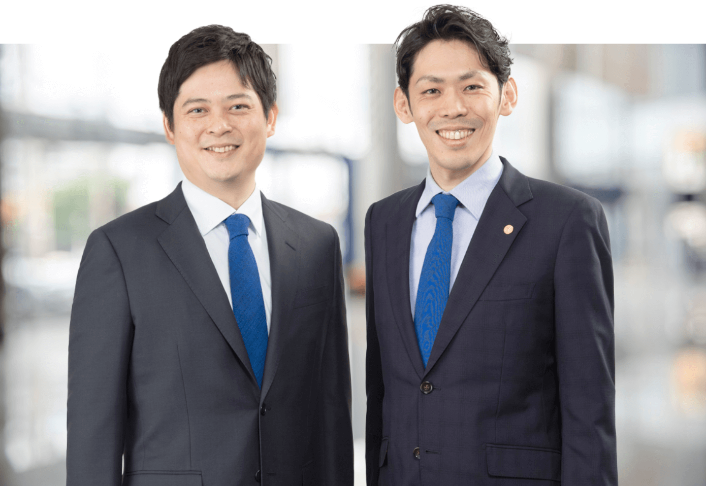 コンサルタントの越智達也と岡本行勉の写真